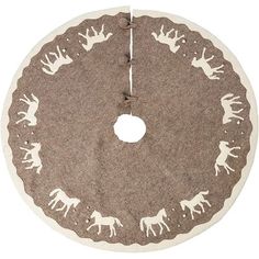 a brown and white rug with deers on the bottom is hanging from a hook