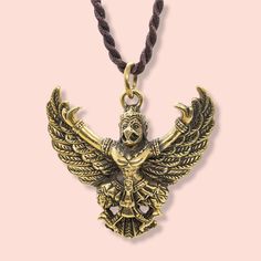 ✨A beautigul Garuda gold plated pendant, this piece is sure to make a statement.  ✨The Buddha Talisman Powerful Garuda Bird Pendant Necklace has the power to calm and protect the wearer. This is a beautiful and powerful talisman for good luck and protection. The Garuda pendant is made of brass gold-plated material and its design of the powerful Garuda bird pendant will make the difference. The Buddha Talisman is a powerful and spiritual charm that will give you protection, luck, and guidance.  ✨This Buddha pendant features a powerful Garuda Bird which is shown with its wings open and flying in an upward direction. The Garuda Bird Pendant Necklace is a beautiful pendant necklace with a powerful talisman inside. The Garuda is the powerful protector of good luck, and it is also the messenger Magic Pendant, Beautiful Pendant Necklace, Buddhist Traditions, Spiritual Symbols, Hindu Mythology, Buddha Pendant, For Good Luck, Bird Pendant, Lucky Charms