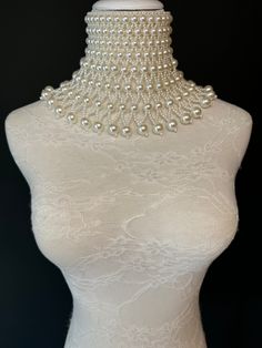 Handmade Chocker Style pearl shoulder body Jewellery.  High quality pearls. Statement piece. Perfect for special events, fashion shows, bridal, special evenings, weddings.  Stunning Ivory pearls with bead detail.  UK Size 6-12 White Pearl Button Jewelry For Party, White Jewelry With Pearl Buttons For Parties, Party Pearl Backdrop Necklace, Pearl Backdrop Necklace For Parties, Beaded Pearl Bridal Accessories For Wedding, Party Pearl Necklace, Pearl Party Necklace, Pearl White Pearl Chain Necklace For Party, Party Pearl Drop Backdrop Necklace