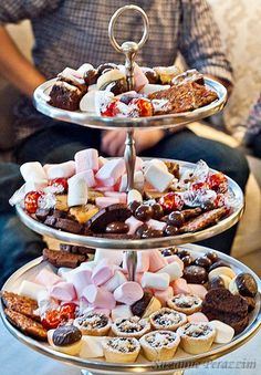 three tiered trays filled with assorted pastries