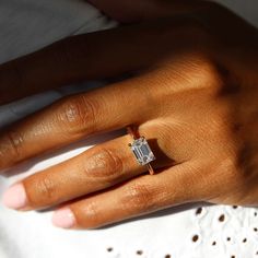 a woman's hand with a ring on it