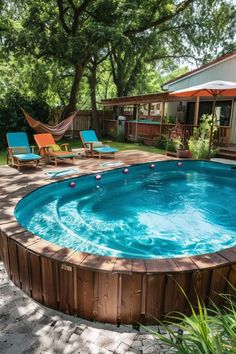 an above ground pool surrounded by lawn chairs