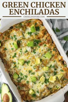 green chicken enchiladas in a white casserole dish with avocado on the side