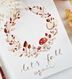 a card with the words let's go again written on it next to some dried flowers