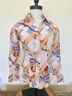 "70s White Tara unique print blouse White Tara is the Bodhisattva of compassionate activity This rare and pristine blouse is in excellent vintage condition Looks like it has never been worn. White buttons Two button cuffs Brand - Jeune Belles Tag size 7/8, most likely a xsmall/small, go by the measurements 100% Rayon FREE SHIPPING Measurements laying flat: Bust - 16\" Sleeve - 21\" Length - 21.5\"" Retro Long Sleeve Blouse For Vintage Fashion, Retro Patterned Printed Shirt, Vintage Print Long Sleeve Tops, Long Sleeve Tops With Vintage Print, Vintage Fitted Printed Tops, White Retro Print Tops, Fitted Vintage Printed Tops, Vintage White Blouse With Floral Print, Vintage White Floral Print Blouse