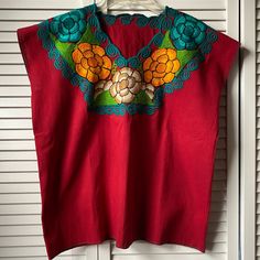 Embroidered Mexican Red Blouse, Size M Please See Photos For Measurements New Without Tags Red Bohemian Embroidered V-neck Top, Red V-neck Blouse With Floral Embroidery, Red Embroidered V-neck Blouse, Red Floral Embroidered Top, Red Sleeveless Tops With Floral Embroidery, Sleeveless Red Tops With Floral Embroidery, Red Sleeveless Top With Floral Embroidery, Red Folk Tops With Floral Embroidery, Casual Red Tops With Floral Embroidery