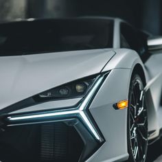 the front end of a white sports car