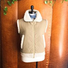 ~Follow Chickaboomvintage Here & On Instagram~ Betmar Of New York 1970’s Vintage Khaki Quilted Sherpa Ribbed Utility Workwear Vest- Size M Absolutely Gorgeous, Vintage 70’s, Faux Sheepskin & Khaki, Zig-Zag Quilted Workwear Vest Has Thick, Cream-Colored Ribbing At The Hemline. Talon Zipper, Slash Pockets, Rounded Snub Collar. Warm, Snuggly & Perfect Over Vintage Denim Or Bells. Perfect Over Turtlenecks, Tees & Plaids. Excellent Condition. Measurements- B-38 L-22 W-36 Shoulders-17 Hem-32 Vintage Outerwear For Fall Layering, Retro Khaki Outerwear For Fall, Retro Winter Outerwear For Layering, Retro Winter Layering Outerwear, Retro Beige Patchwork Outerwear, Beige Retro Patchwork Outerwear, Retro Spring Outerwear For Layering, Vintage Brown Outerwear For Layering, Retro Cream Outerwear For Fall