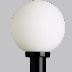 a black and white lamp on a gray background with the light turned off to show it's dimmerance