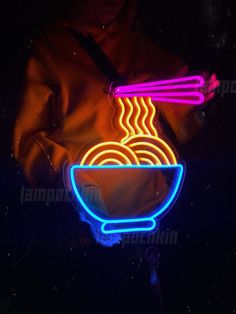 a neon sign with noodles in a bowl