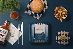 a blue table topped with lots of food and condiments