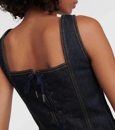 Material: 100% cotton.Care instructions: hand wash.Made in Italy.Designer color name: Indigo.Closure: buttoned front.True to size.Fitted.Non-stretchy fabric.Cropped.The model seen in the picture is 178cm-5'10' and wearing a size FR 36 Dark Wash Summer Corset, Fitted Cotton Top With Corset Back, Spring Fitted Corset With Buttons, Fitted Dark Wash Corset, Spring Cotton Fitted Corset, Fitted Corset With Button Closure, Dark Wash Fitted Top With Buttons, Fitted Dark Wash Top With Buttons, Jean Paul Gaultier Denim