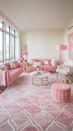 a living room filled with pink furniture and decor on top of a white carpeted floor