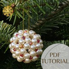 a white ornament hanging from a christmas tree