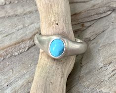 Handmade, minimalist ring in a simple design drawing attention to the natural blue turquoise stone.  This ring is solid and made with Sterling Silver.  It is a US size 7. Please let me know if you have any questions. Minimalist Turquoise Ring For Everyday, Minimalist Everyday Turquoise Rings, Minimalist Turquoise Open Ring For Promise, Handmade Adjustable Minimalist Turquoise Ring, Minimalist Adjustable Turquoise Ring For Everyday, Minimalist Blue Turquoise Open Ring, Adjustable Minimalist Turquoise Open Ring, Minimalist Turquoise Oval Ring, Handmade Minimalist Turquoise Ring