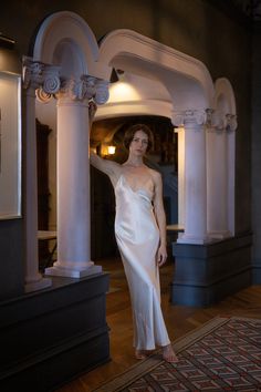 Stunning floor length bias cut gown with deep v-neck and spaghetti straps in a rich, fluid-like alabaster silk charmeuse. Erica Tanov Details Made in USA. 100% Silk. Dry clean only. Charmeuse Gown, Erica Tanov, Silk Charmeuse Dress, Charmeuse Dress, Alpaca Wool Sweater, Bath And Body Shop, Silk Camisole, Silk Slip Dress, Color Art