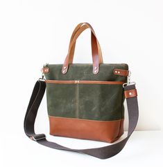 Green Waxed Canvas Tote Bag/Crossbody Bag   *Vegetable Tanned Genuine Leather  Approximate  Dimensions: 15.5" Top Wide, 11"Wide (at base) x 10.5"High x 4"Deep 40cm Wide Top, 28cm Wide (at base) x 27cm Hide x 9 cm Deep This beautiful tote bag/crossbody bag has been made with green waxed canvas fabric and brown genuine leather. The bag is lined with brown waterproof canvas fabric. There are 2 slip pockets in the front and a zipper pocket at the back side of the bag. There are zipper and 2 slip pockets in the bag. * For more colours, you can contact with no hesitate. Fabric and Washing guidelines: Waxed canvas  is a durable fabric that is made out of 100% sturdy cotton canvas and processed with waxed for water resistance. It is medium weight.  You can clean it with a damp cloth. I would not r Green Canvas Bag, Waxed Canvas Tote Bag, Green Crossbody Bag, Grey Tote Bags, Grey Crossbody Bag, Waxed Canvas Bag, Green Tote Bag, Red Leather Handbags, Green Tote