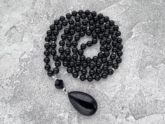 Black Necklace, Black Agate Long Necklace, 108 Mala Bead Necklace, Gift  for Man for Women, Hand Knotted Black Onyx Drop Pendant Necklace -  8mm Black Agate 108 beads -  10mm Black Onyx Guru bead -  Black Agate Pendant The necklace you see in the photo are made from 108 beads, each with a diameter of 8mm, creating a beautifully crafted piece. The length of the necklace is approximately 40 inches plus 4cm pendant.  Since I custom-make these necklaces, I can make them any length but also make alte Black Crystal Necklaces With Round Gemstone Beads, Elegant Black Jewelry With 108 Beads, Black Polished Beads Necklace For Meditation, Black Obsidian Necklace With 8mm Beads, Black Obsidian Necklace With 108 Beads, Black Onyx Round Bead Crystal Necklaces, Black Crystal Necklaces With Round Natural Stones, Black Faceted Spiritual Beads, Spiritual Black Crystal Necklaces With Faceted Beads