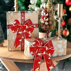 two wrapped presents sitting on top of a table