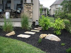 a front yard with stepping stones and plants