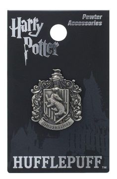 the harry potter badge is shown on a black and white background, with an image of hog