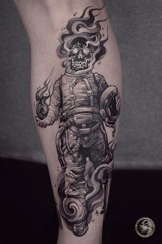 a man's leg with a tattoo on it that has a skeleton in the space suit