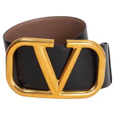 100% authentic Valentino VLOGO wide reversible waist-belt in light tan and black calfskin featuring a chunky gold-tone metal logo buckle. Has been worn once or twice and is in excellent condition. Comes with dust bag and box. Measurements Tag Size 75 Width 7cm (2.7in) Fits 72cm (28.1in) to 77cm (30in) Length 105cm (41in) Buckle Size Height 9.5cm (3.7in) Buckle Size Width 16cm (6.2in) Hardware Gold-Tone All our listings include only the listed item unless otherwise specified in the description ab Classic Black Belt With Logo, Designer Black Belt With Metal Logo, Designer Black Belts With Metal Logo, Brown Leather Belt With Logo Plaque, Luxury Black Belt Buckles With Gold-tone Hardware, Designer Leather Belt Buckles With Logo, Designer Leather Belt With Logo, Luxury Black Belt Buckle With Gold-tone Logo Plaque, Designer Black Belt With Gold-tone Logo Plaque