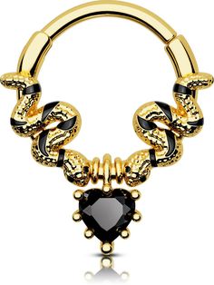 a gold and black heart shaped nose ring