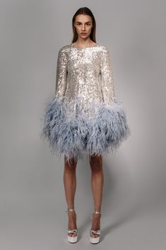 a stretch sequin cut mini dress with ostrich plumes that increase in volume as they move down the dress and sleeves   Fit: Nina is 5ft 10'' and wears a size 0 Composition: 90% polyester/10% elastane, 100% natural ostrich feathers Made in: India Feather Dress Short, Christmas Party Dresses, Christmas Outfit Ideas, Funky Dresses, Derby Dress, Outfits Dress, Disco Dress, Theme Dress, Feather Trim