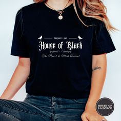 House of Black Adult Unisex Shirt  :: GARMENT INFO :: - 100% Soft cotton (fibre content may vary for different colors) - The sleeves are rolled up for display purposes only :: SIZING :: - The Unisex sizing makes the shirt run larger than your average t-shirt (for women). We suggest ordering a size smaller than what you would normally wear for a tighter fit. The shirts run true to size for men. - Please check out our size chart for measurements to ensure an accurate fit - No returns/exchanges for Black Bookish T-shirt With Screen Print, Black Bookish Tops With Text Print, Black Bookish Top With Text Print, Black Bookish Top With Letter Print, Black Letter Print Top For Bookish Style, Black Chemise, House Of Black, Wizard School, Book Shirt