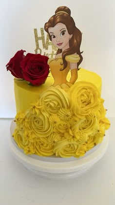 there is a yellow cake decorated with flowers and a princess figure on the top tier