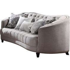 a gray couch with pillows on top of it