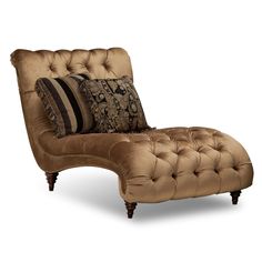 a brown chaise lounge chair with pillows on it