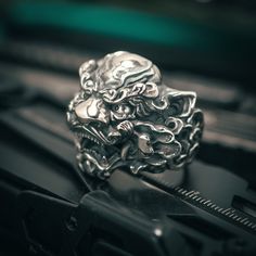 This Chinese Guardian Lion ring is beautifully crafted with high quality sterling silver. The oxidized finish reveals the details of our original design by developing a great contrast between the recesses and the raised parts of the piece. The inside surface, against the finger, is hand-polished to a mirror finish with a comfortable fit. It is very ideal for everyday use. ☆ Weight: 28g ☆ Dimensions: 0.98" X 1.11"   ☆ Material: sterling silver 925 How to measure your finger for ring --------------------------------------------- ☆    To ensure the most accurate ring size, we recommend you visit your local jeweler for a professional sizing. ☆    Don't measure cold fingers, as this is when fingers are the smallest. The best time to measure a finger is at the end of the day when the finger is t Chinese Guardian Lion, Chinese Lion, Guardian Lion, Cold Fingers, King Ring, Silver Men Ring, Lion Ring, Handmade Silver Ring, Foo Dog