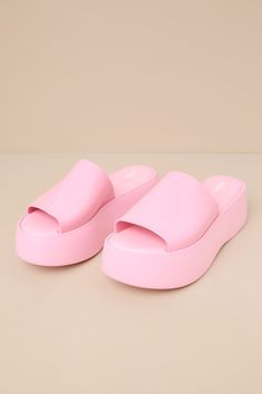 Cue the 90s nostalgia, because the Melissa Becky Pink Flatform Slide Sandals will be bringing a whole lot of throwback vibes! These chunky and cute sandals feature an almond-shaped footbed (atop a 1.5"" toe platform) and an extra-wide, shiny vinyl vamp strap that creates a classic peep-toe upper. From mini skirts to cutoffs, these shoes will be the perfect addition to any summer look! Available in whole sizes only. 2" flatform sole. Cushioned insole. Rubber sole has nonskid markings. Man made ma Trendy Open Toe Slides With Padded Heel, Pink Round Toe Platform Slippers, Trendy Summer Slides With Open Heel, Trendy Pink Round Toe Platform Slippers, Pink Cushioned Platform Slippers, Synthetic, Pink Synthetic Platform Slippers With Cushioned Footbed, Trendy Summer Slides With Padded Heel, Trendy Flat Sandals With Padded Heel, Trendy Synthetic Slides With Round Toe