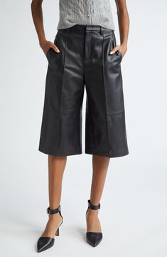 A longer length brings edgy style to these leather shorts that'll smoothly slip into high rotation with their versatile design. 16" inseam; 26" leg opening; 11" front rise; 13 1/2" back rise (size 8) Zip fly with hook-and-bar closure Front slant pockets; back welt pockets Leather Professional leather clean Imported Short Leather Bottoms With Belt Loops, Fitted Short Leather Bottoms, Fitted Leather Shorts, Fitted Short Leather Pants, Knee-length Faux Leather Bottoms For Night Out, Fitted Leather Shorts For Fall, Edgy High Waist Leather Bottoms, Edgy Fitted Leather Shorts, Fitted Edgy Leather Shorts