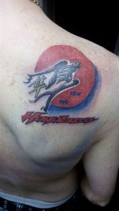 the back of a man's shoulder with an american football helmet and eagle on it