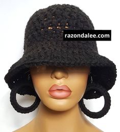 a mannequin head wearing a black crocheted hat