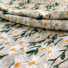 the fabric has daisies on it