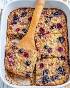 baked oatmeal with berries and blueberries in a casserole dish