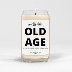 an old age candle sits on a white surface