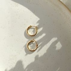 If you're the type of person who relies on staples for everyday wear, snag these classic hoops that will last, wear after wear. An elevated version of our gold fill hoops with an endless snap closure. Sold as a pair. Each purchase comes with an elegant, vegan leather box for storing + caring for your jewelry. DETAILS14k Solid Gold | 15mm hoops Classic 14k Gold Filled Hoop Earrings For Everyday Luxury, Simple 14k Gold Huggie Earrings For Everyday, Simple Everyday 14k Gold Huggie Earrings, Everyday Simple 14k Gold Huggie Earrings, Simple Hypoallergenic Yellow Gold Huggie Earrings, Simple Yellow Gold Tarnish Resistant Huggie Earrings, Simple Everyday Hoop Huggie Earrings, Simple Yellow Gold Tarnish-resistant Huggie Earrings, Everyday 14k Gold Filled Huggie Earrings