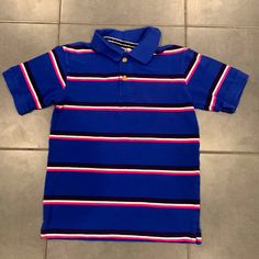 Blue, Pink And White Striped Kids Polo Short Sleeve Polo. Size 7/8. Children’s Place. Good Condition. Make Me An Offer. Bundle It! Preppy Blue Tops For School, Playful Blue Collared Top, Playful Collared Blue Tops, Preppy Blue Collared Top, Blue Collared Preppy Tops, Crossover Top, Childrens Place, Short Sleeve Polo, Pink And White