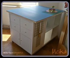 a kitchen island that has drawers on it