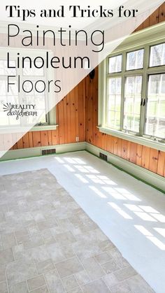 an empty room with wood paneling and tile floors, the words tips and tricks for painting linoleum floors