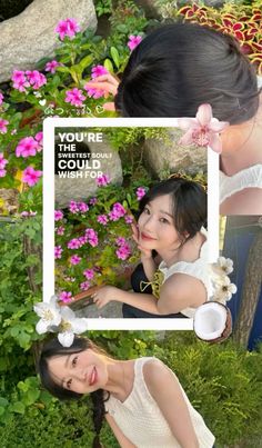 two girls are posing in front of flowers and one girl is holding her hand up to her face