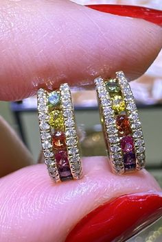 Sparkle and shine with our rainbow sapphire & diamond gold huggie hoop earrings! These stunning earrings feature a colorful array of sapphires and diamonds set in beautiful yellow gold. Elevate any outfit and make a statement with these elegant and eye-catching earrings. Add a touch of luxury to your wardrobe today! Metal: 18K Yellow Gold Diamond Weight: 56 Diamonds 0.19ct t.w.Rainbow Sapphire: 12 Round Sapphire 0.35ct tw Earring Length: 12.6mm x 3.8mm Necklace Guide, Gold Huggie Hoop Earrings, Diamond Initial Necklace, Rainbow Sapphires, Round Sapphire, Jewelry Appraisal, Bridal Engagement Rings, Sparkle And Shine, Eternity Wedding Band