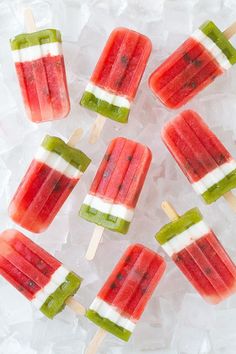 watermelon and kiwi popsicles on ice cubes with toothpicks