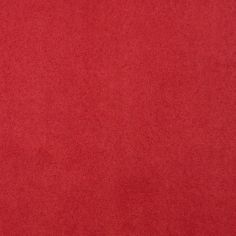 a red fabric textured background or wallpaper that looks like it has been dyed