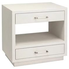 a white night stand with two drawers and one drawer on the bottom, in front of a white background